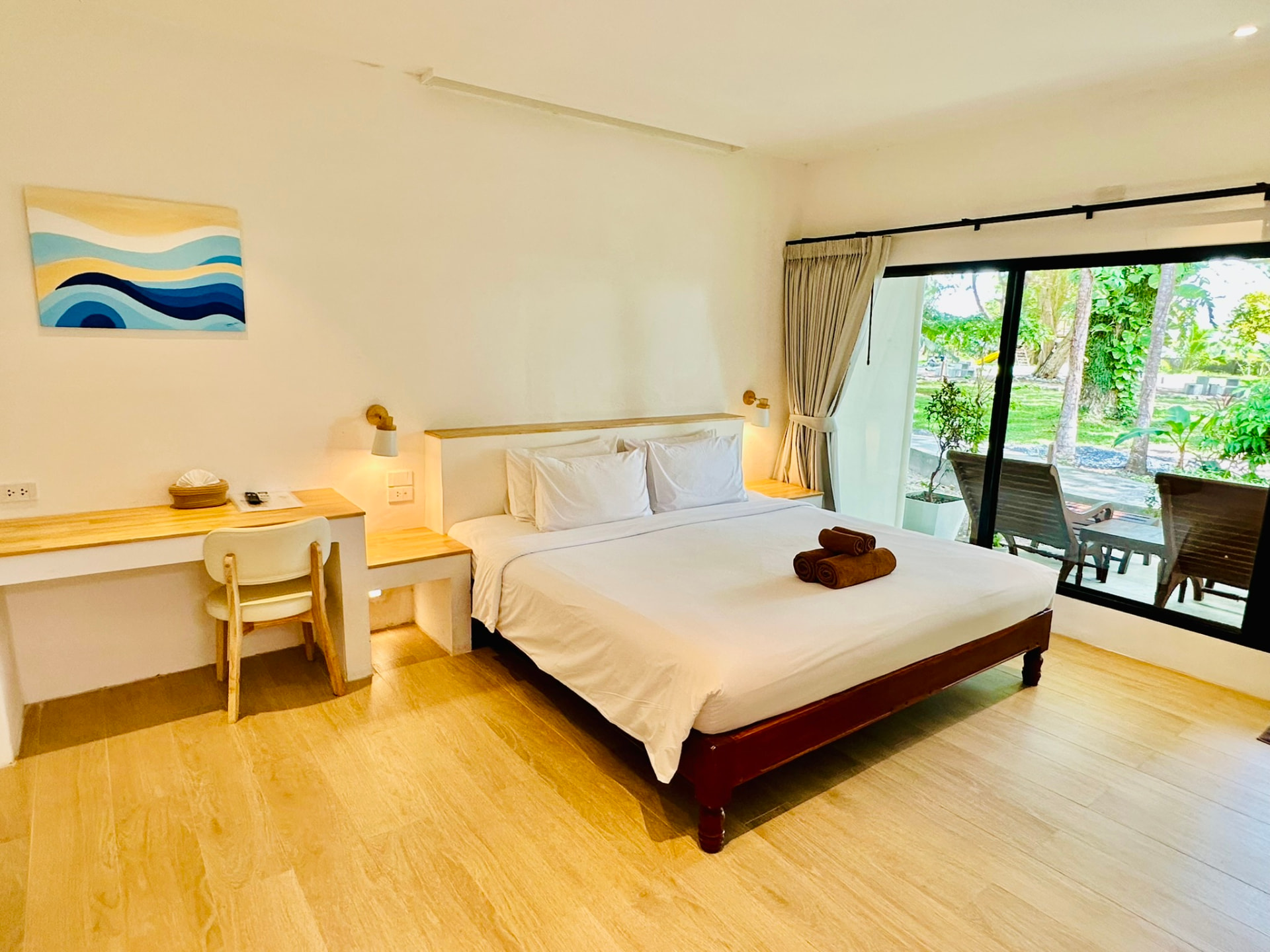 Superior Garden Bungalow with a king bed, desk and open garden view at TwinBay Resort
